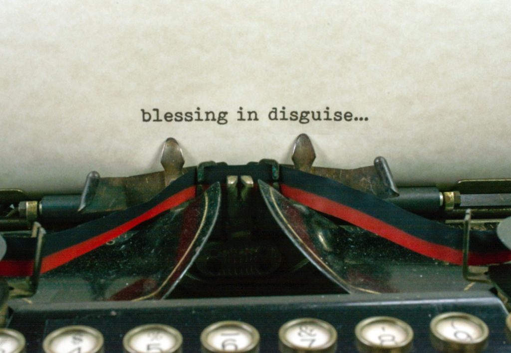 Typewriter showing "blessing in disguise..."